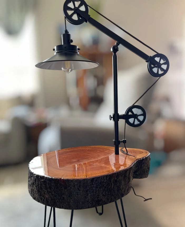 Live-edge wood end table with pulley lamp